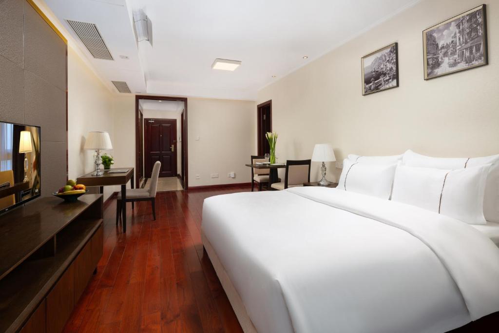 TV a/nebo společenská místnost v ubytování Shenzhen Bay Hisoar Hotel
