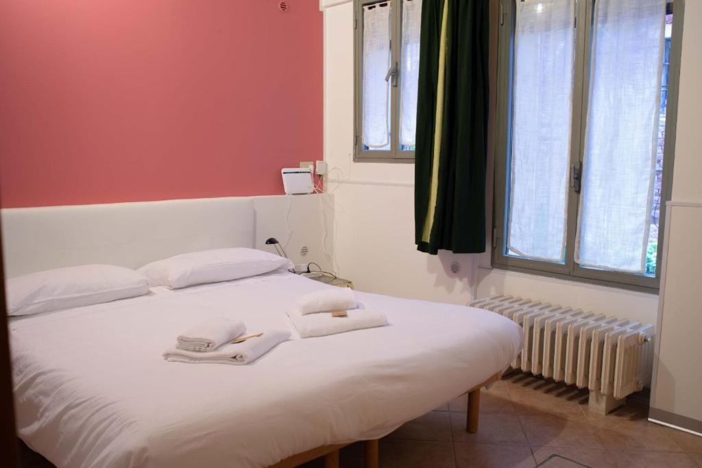 Postel nebo postele na pokoji v ubytování San Marco 3017