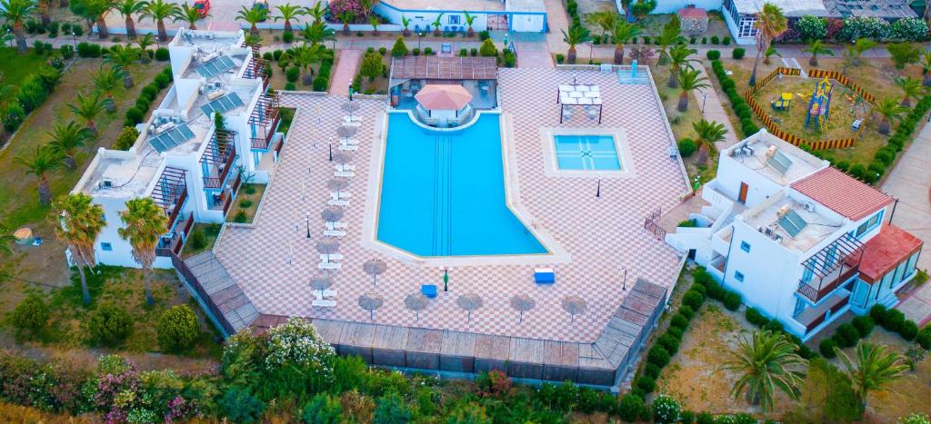 an aerial view of a house with a swimming pool at Sweet Kalimera Apartments in Kardamaina