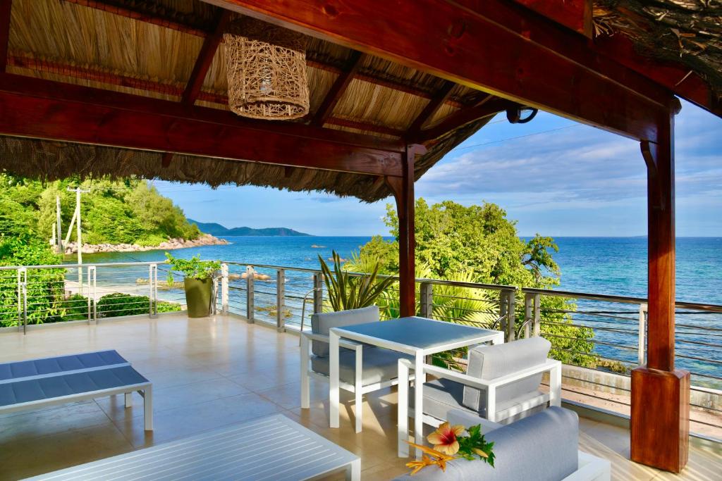 a house with a view of the ocean at SEA SPLASH SELF CATERING And La Petite Maison in Grand Anse