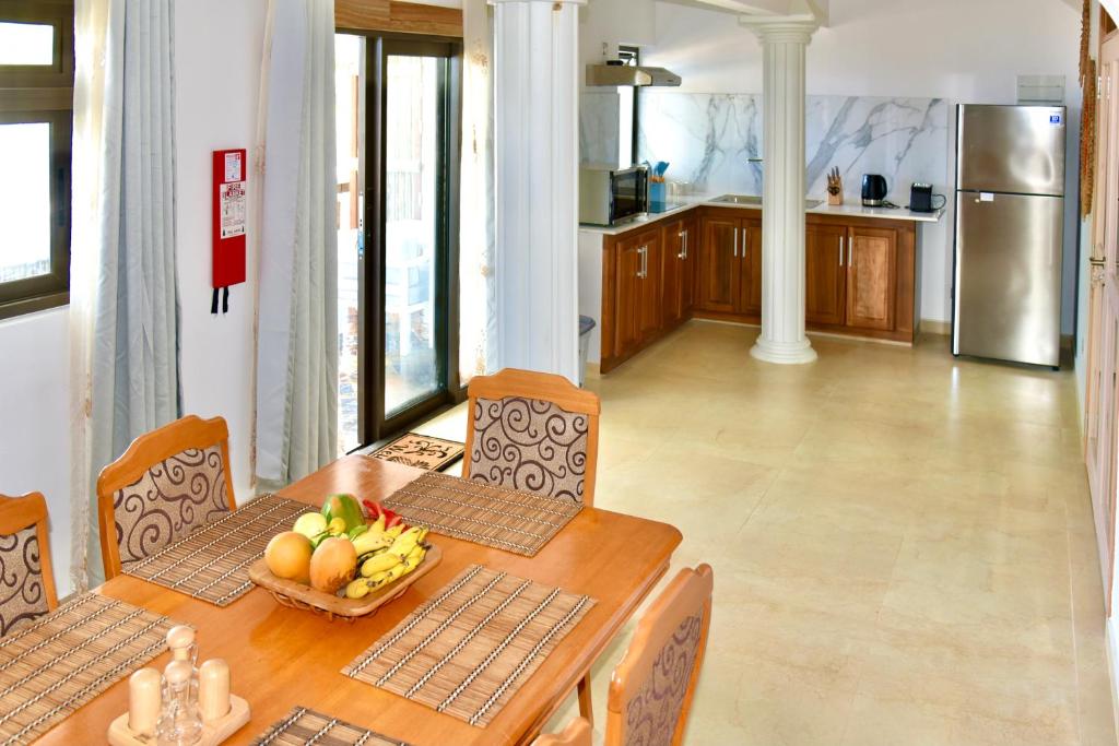 Kuchyň nebo kuchyňský kout v ubytování SEA SPLASH SELF CATERING And La Petite Maison