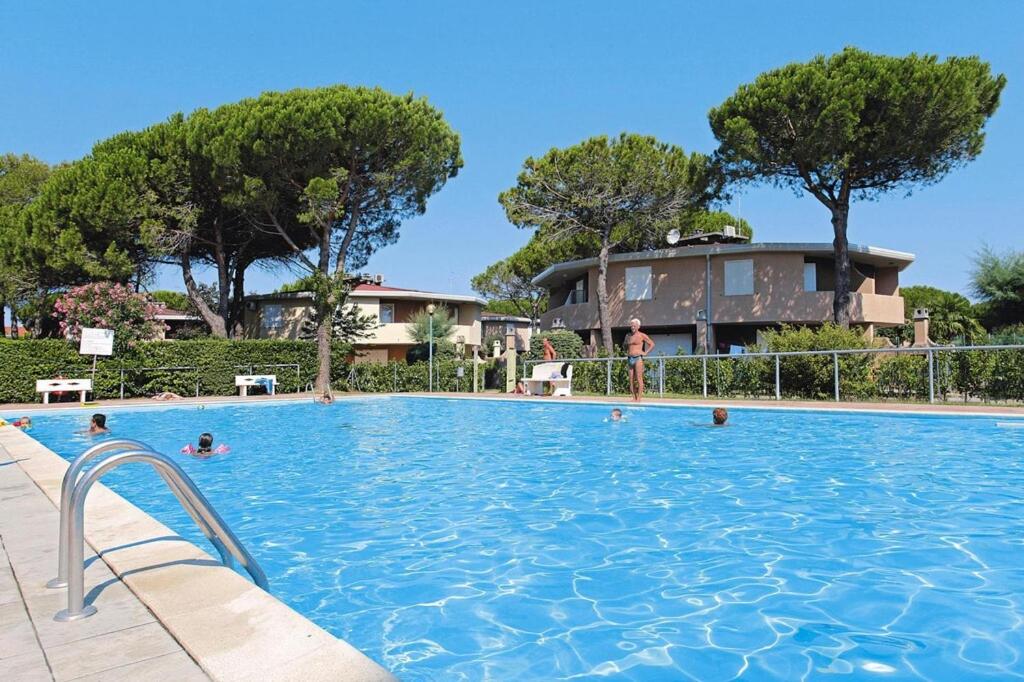 a group of people in a swimming pool at Holiday Village Tivoli in Bibione in Bibione