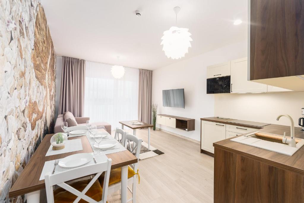Televízia a/alebo spoločenská miestnosť v ubytovaní Sunset Resort II, Nadmorska 104