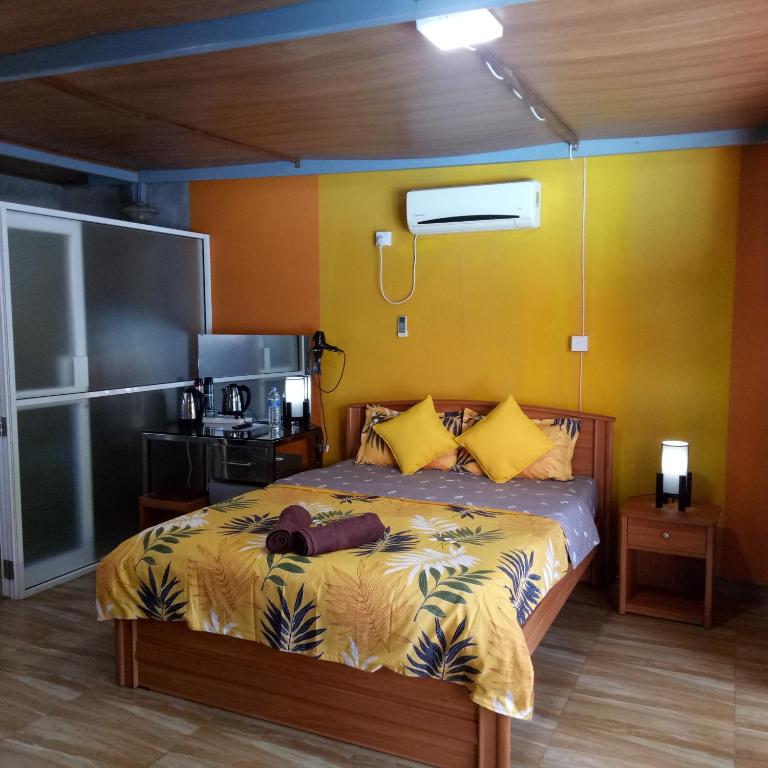 Postel nebo postele na pokoji v ubytování Palms Villa