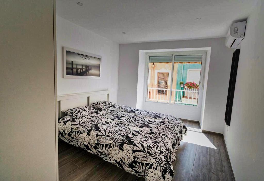 En eller flere senge i et værelse på Luxury Holiday Apartment Pozo II