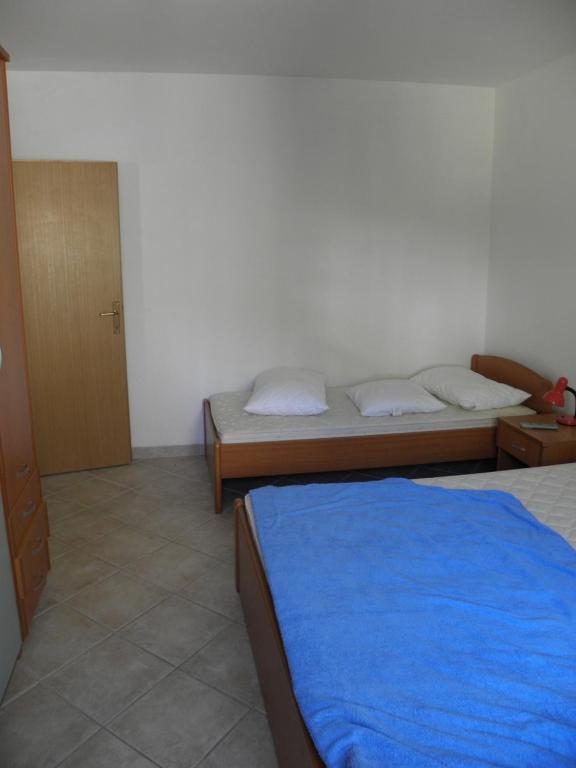 Posteľ alebo postele v izbe v ubytovaní Apartment in Podgora with sea view, terrace, air conditioning, WiFi 3812-3