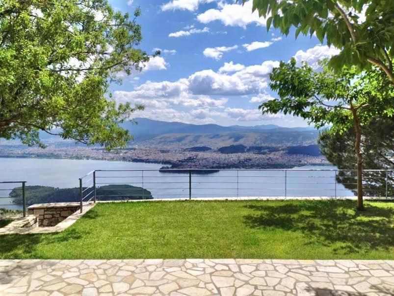 a park with a view of a body of water at Ktima Papadimitriou in Ioannina
