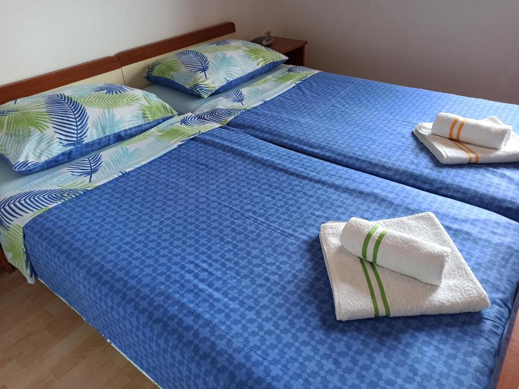 Postelja oz. postelje v sobi nastanitve Apartments Kornati