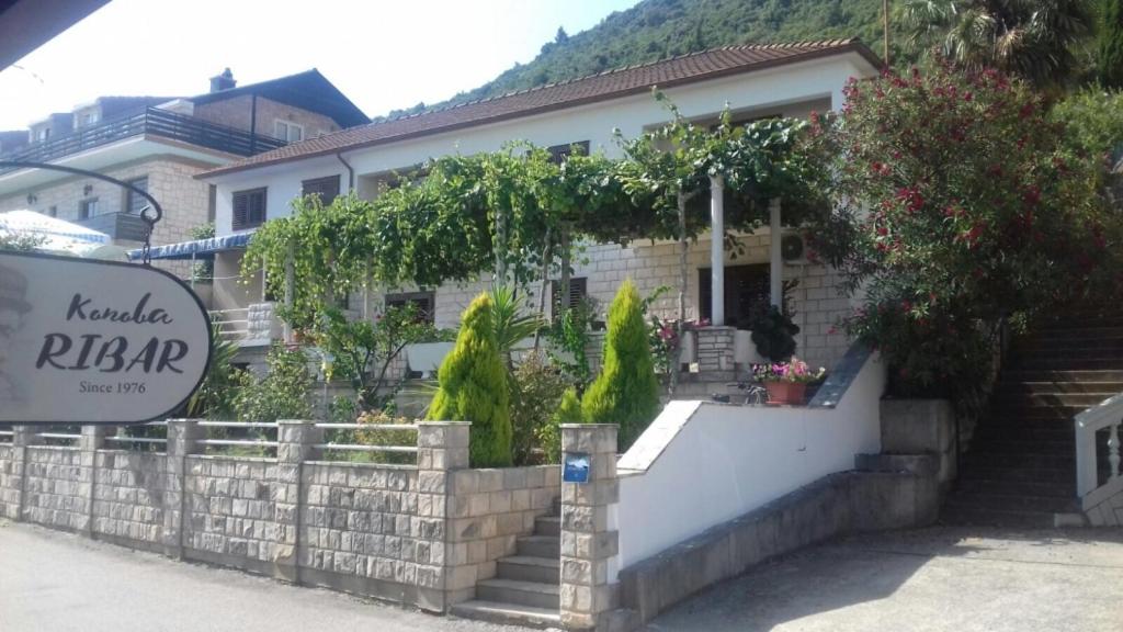a house with a sign in front of it at Apartment 4199-2 for 3 people in Trpanj in Trpanj