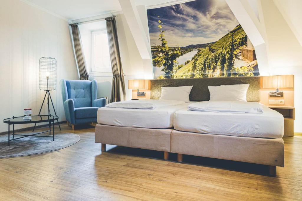 Ein Bett oder Betten in einem Zimmer der Unterkunft Hotel Deutschherrenhof