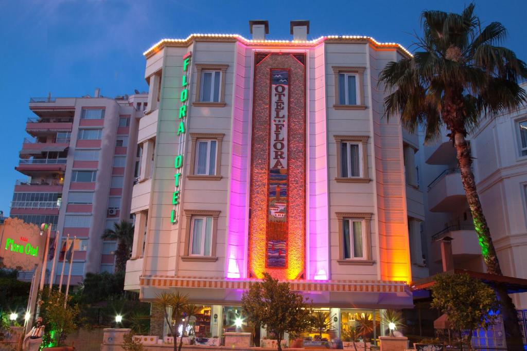 a building with a lit up sign on it at Nasa Flora Hotel in Antalya