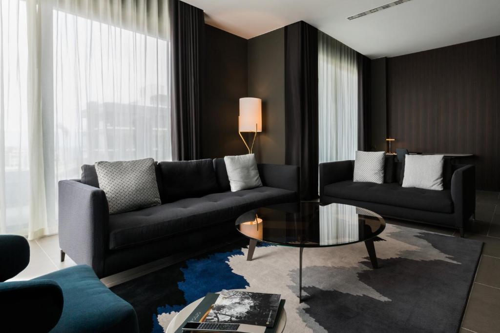 a living room with two couches and a coffee table at InterContinental Malta by IHG in St Julian's