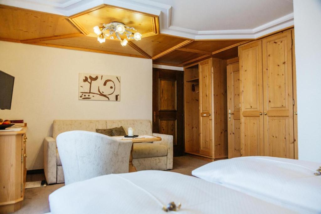 Postel nebo postele na pokoji v ubytování Hotel Kristall