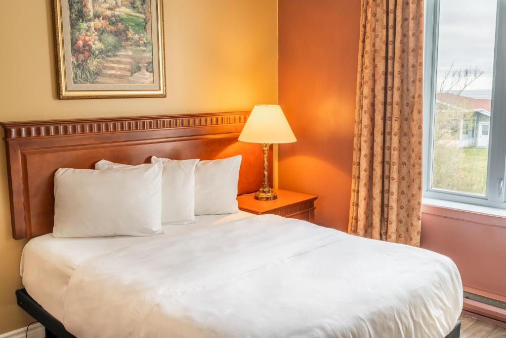 Postel nebo postele na pokoji v ubytování Hôtel Motel La Vigie