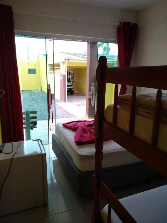 Postel nebo postele na pokoji v ubytování Residencial Alexandre