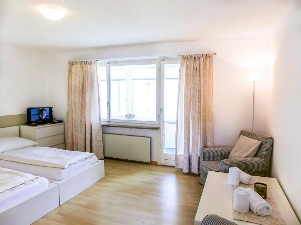 Postel nebo postele na pokoji v ubytování Apartment Chesa Ova Cotschna 304 by Interhome