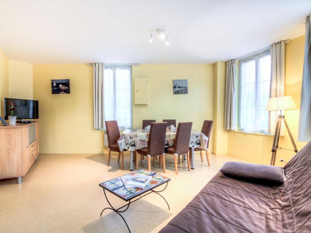 a living room with a table and chairs at Apartment Orléans by Interhome in Trouville-sur-Mer