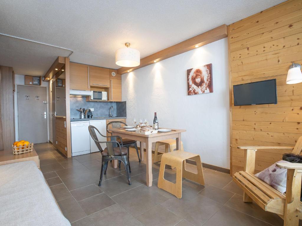 a kitchen and dining room with a table and chairs at Studio Les Grandes Platières-11 by Interhome in Tignes