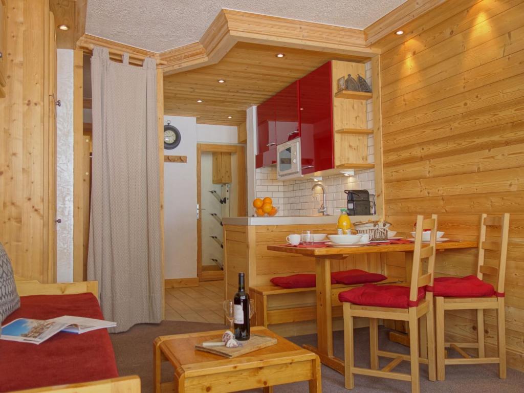 a kitchen with a table and chairs in a room at Apartment Le Pramecou-5 by Interhome in Tignes