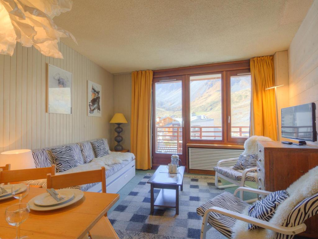 a living room with a couch and a table at Apartment Le Curling B-27 by Interhome in Tignes
