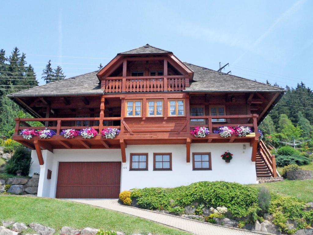 a large house with a balcony and a garage at Apartment Blank by Interhome in Titisee-Neustadt