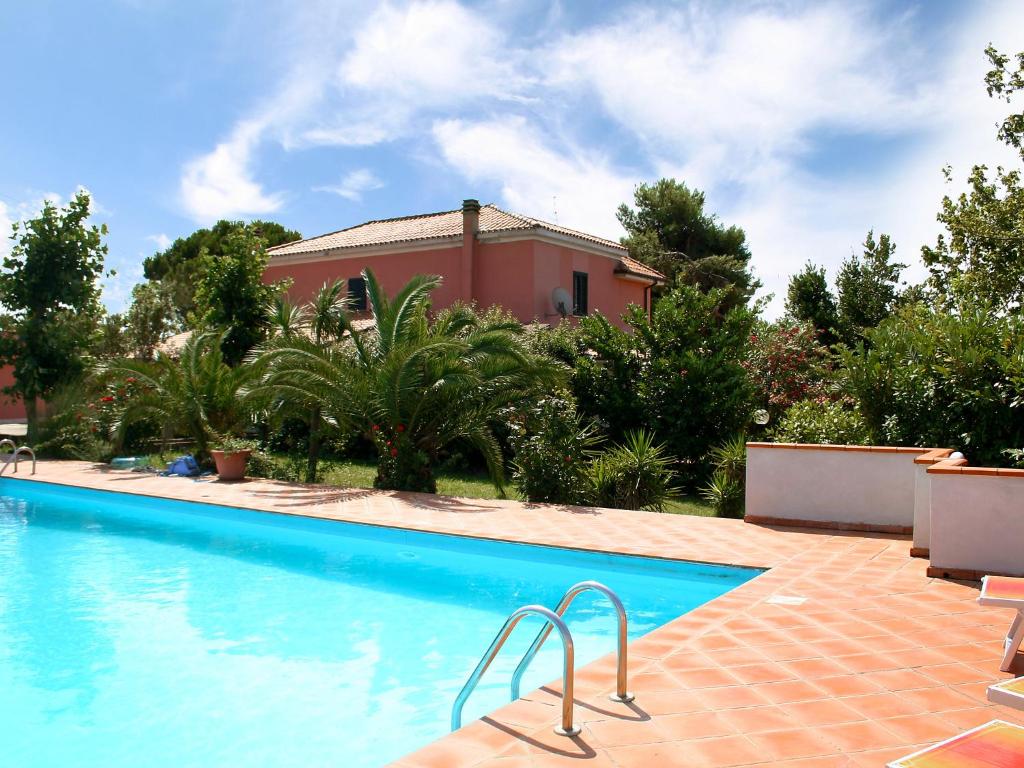 a swimming pool in front of a house at Holiday Home Breda by Interhome in Citta' Sant'Angelo