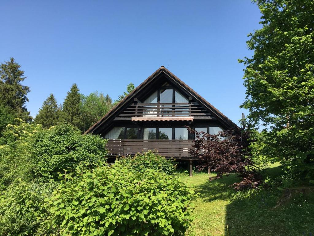 a cabin in the woods with trees at Holiday Home Ferienpark Vorauf-4 by Interhome in Molberting