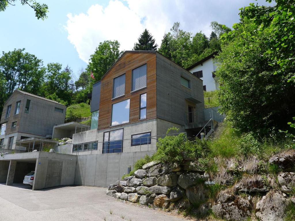 a house on top of a hill at Apartment Melina by Interhome in Laax