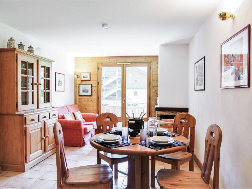 a dining room with a table and chairs at Apartment Les Capucins by Interhome in Chamonix