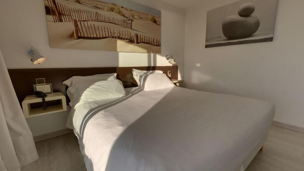 Postel nebo postele na pokoji v ubytování Brasilia Hôtel