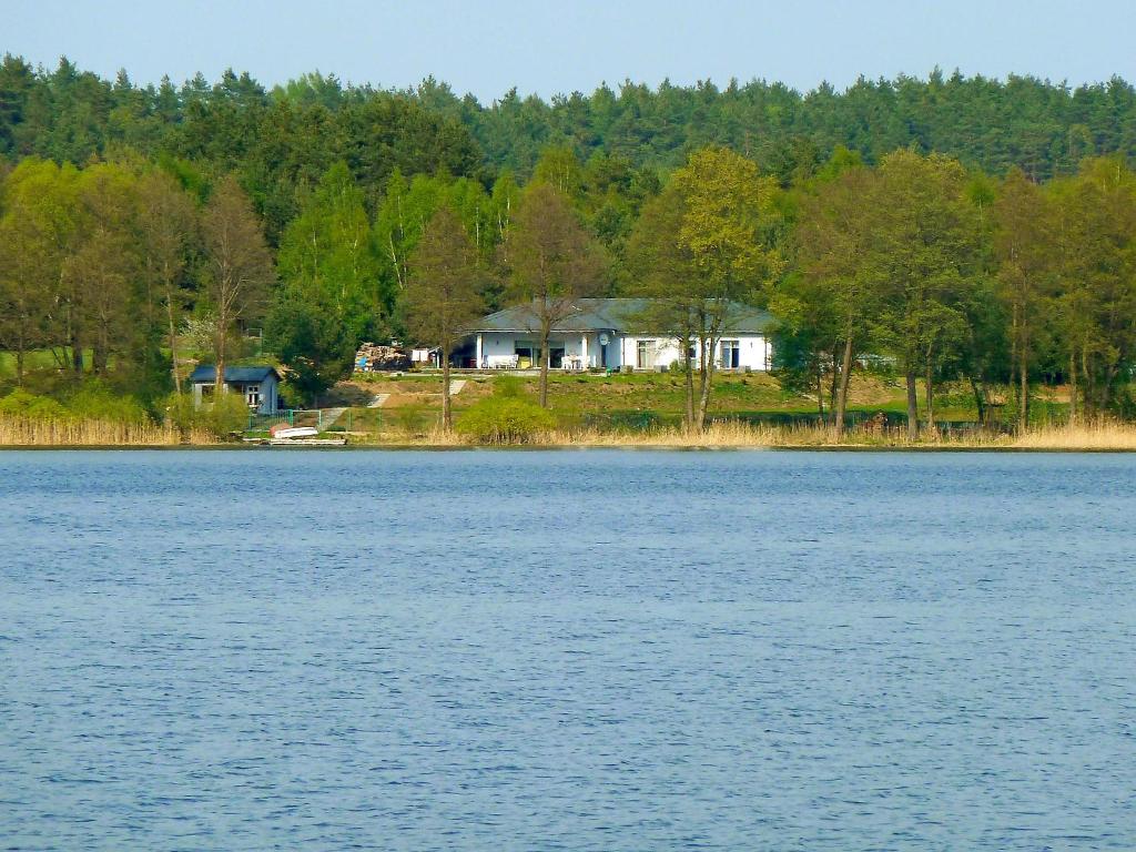 a house on the shore of a large lake at Apartment Głęboczek 21 by Interhome in Głęboczek
