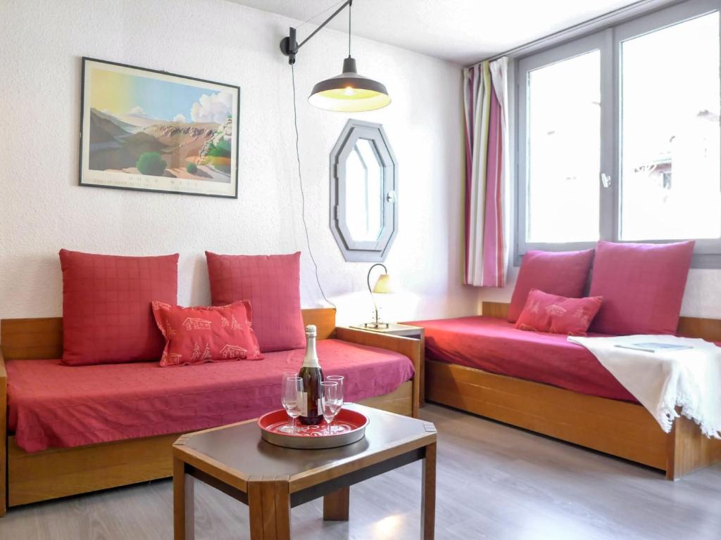 a living room with two beds and a table at Apartment Le Chamois Blanc-8 by Interhome in Chamonix