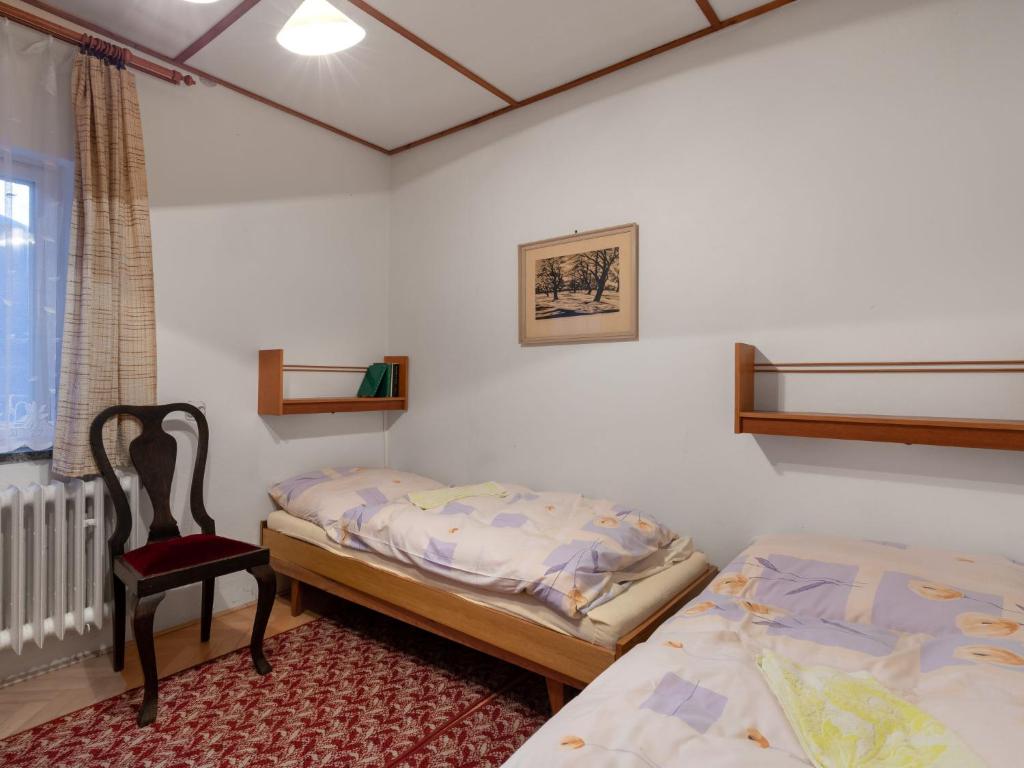 Postel nebo postele na pokoji v ubytování Holiday Home Milovice by Interhome