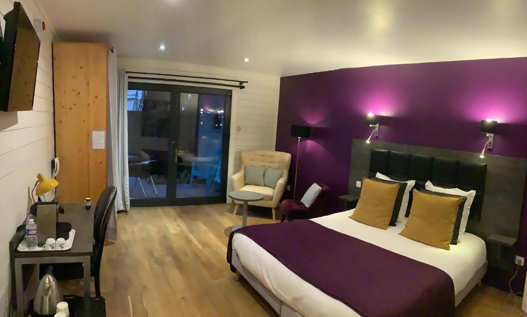 Postel nebo postele na pokoji v ubytování Hôtel Monet