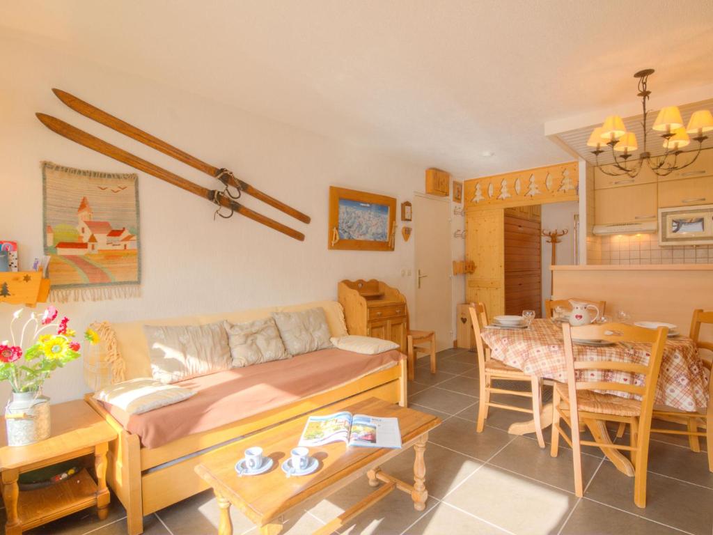 a living room with a couch and a table at Apartment Les Grandes Platières-2 by Interhome in Tignes