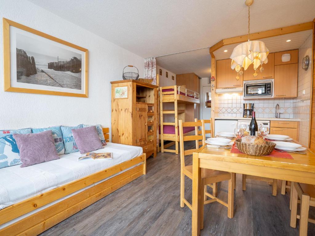 a room with a bed and a table and a kitchen at Studio Les Grandes Platières-26 by Interhome in Tignes