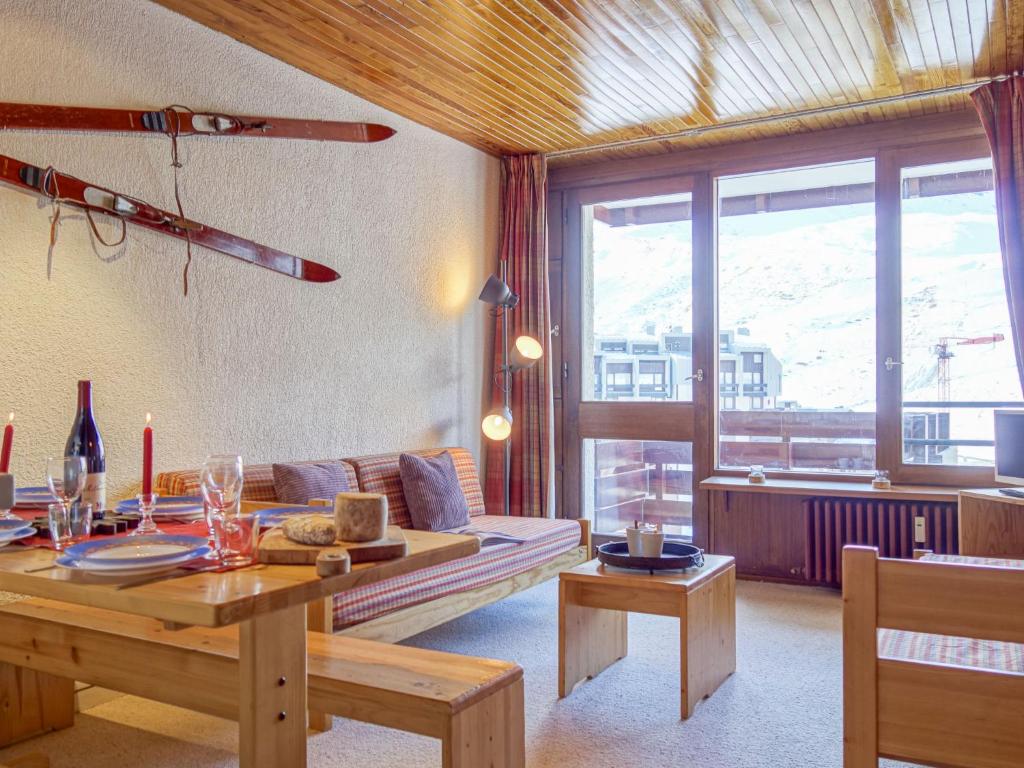 a living room with a couch and a table at Apartment Les Hauts du Val Claret - Val Claret-22 by Interhome in Tignes