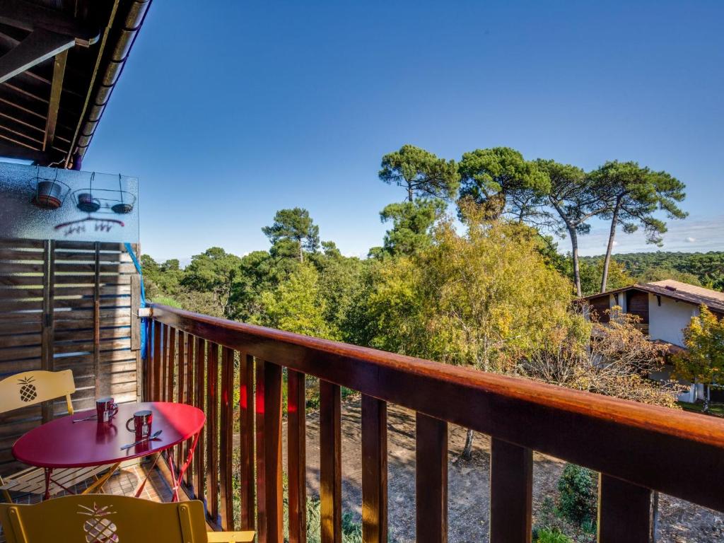 a balcony with a view of the forest at Apartment Résidence Le Parc by Interhome in Arcachon