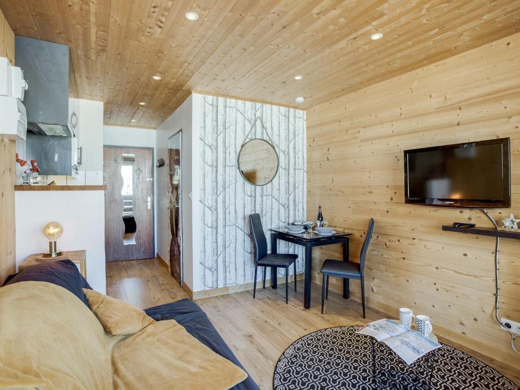a living room with a couch and a table at Studio Le Curling A-21 by Interhome in Tignes
