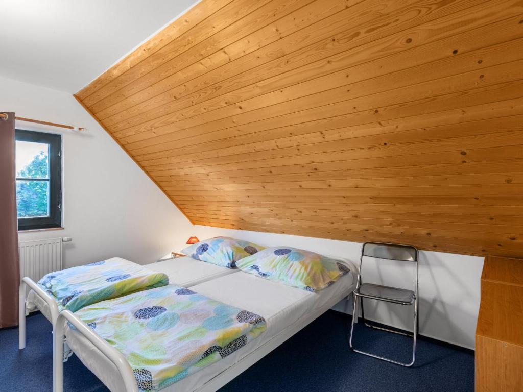 Postel nebo postele na pokoji v ubytování Holiday Home Holiday Hill 51 by Interhome