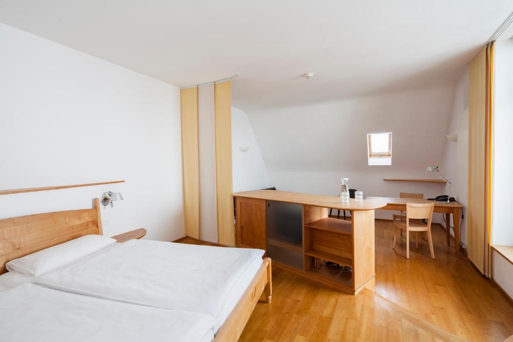 Postel nebo postele na pokoji v ubytování City-Hotel Ochsen