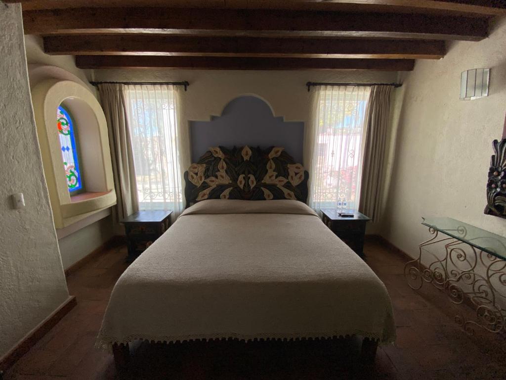 Postel nebo postele na pokoji v ubytování Casa Árbol Hotel