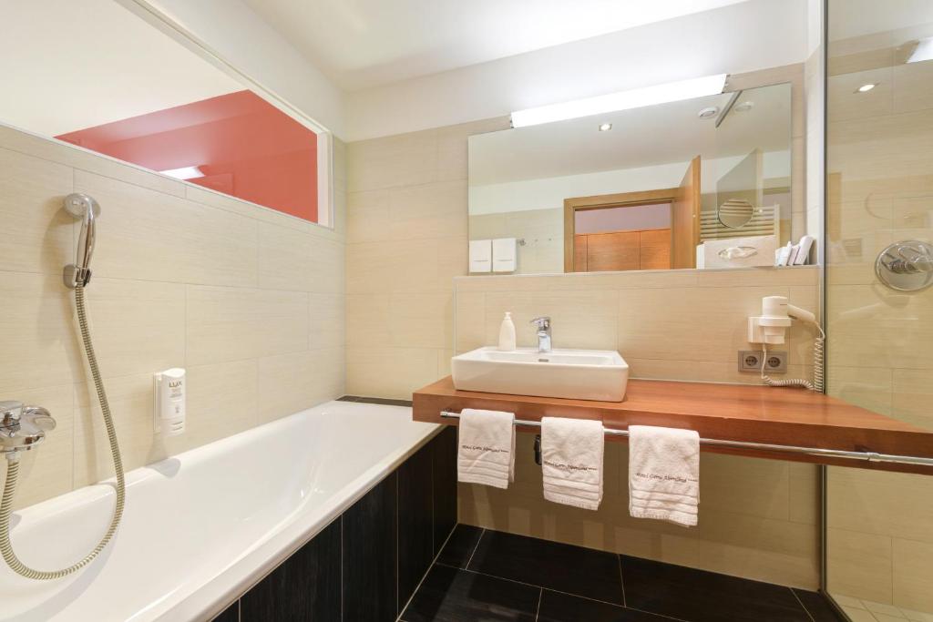 Kúpeľňa v ubytovaní Hotel Alpenland