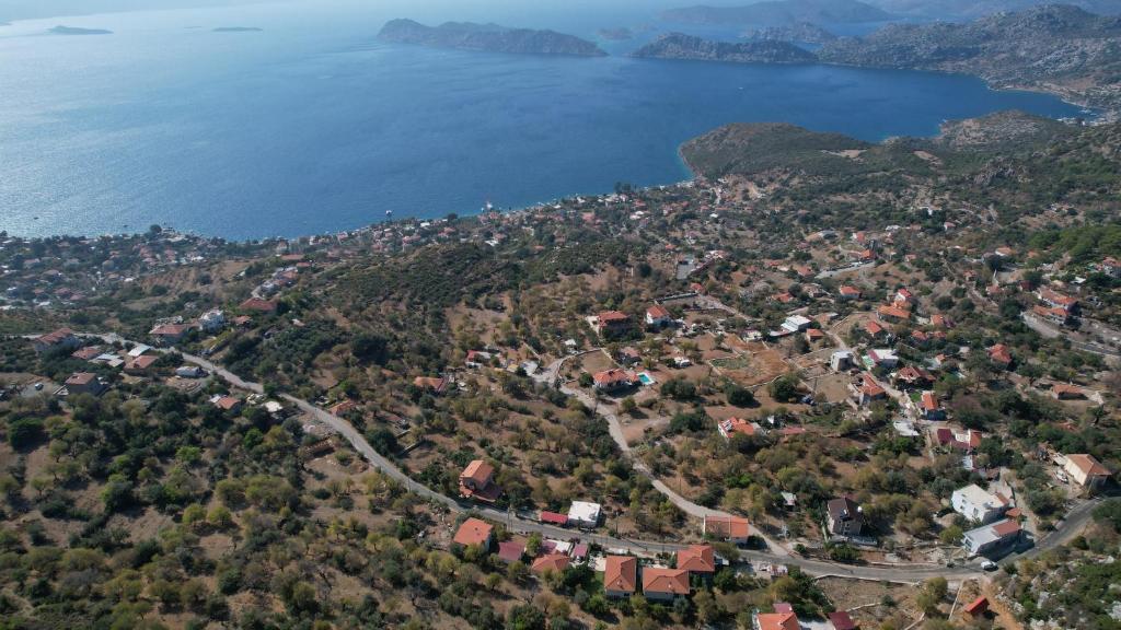 an aerial view of a town on a hill next to the water at Massi Söğüt 1 in Sogut