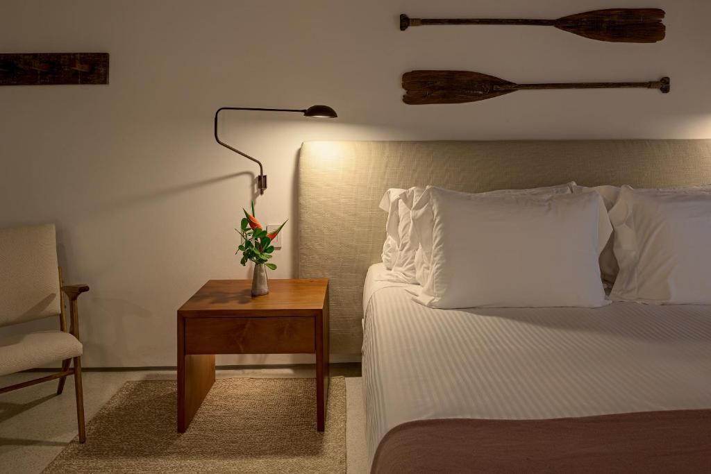 Postel nebo postele na pokoji v ubytování Hotel Fasano Trancoso