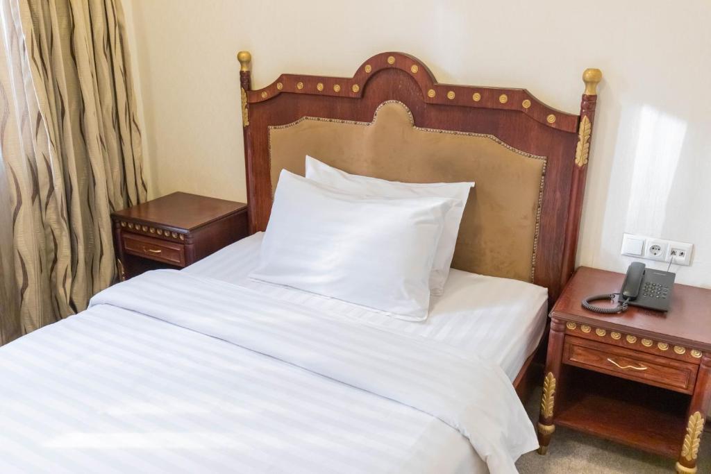 Postel nebo postele na pokoji v ubytování Hotel Afa