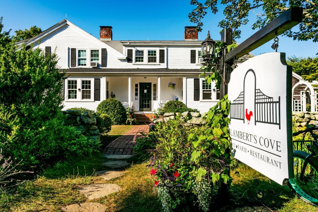 a white house with a sign in front of it at Lambert's Cove Inn & Resort in West Tisbury