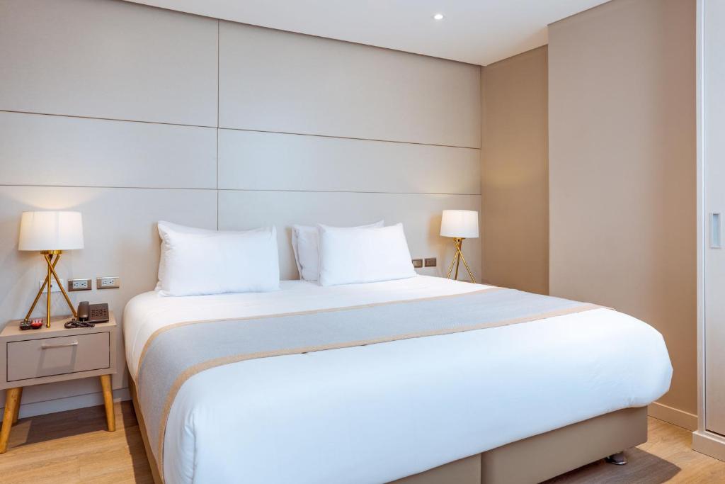 Postel nebo postele na pokoji v ubytování Hotel City Bog Corferias