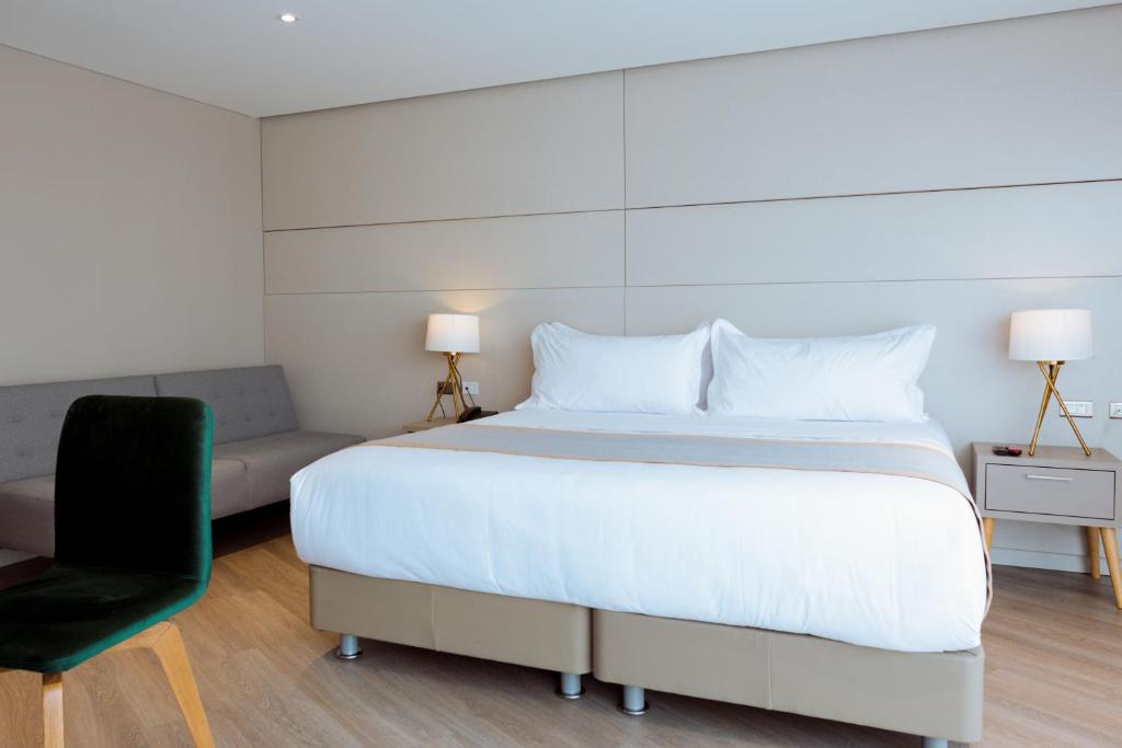Postel nebo postele na pokoji v ubytování Hotel City Bog Corferias