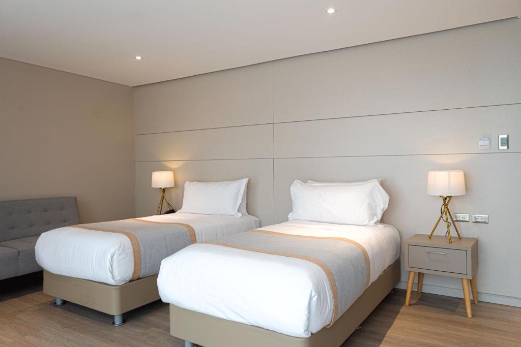 Postel nebo postele na pokoji v ubytování Hotel City Bog Corferias